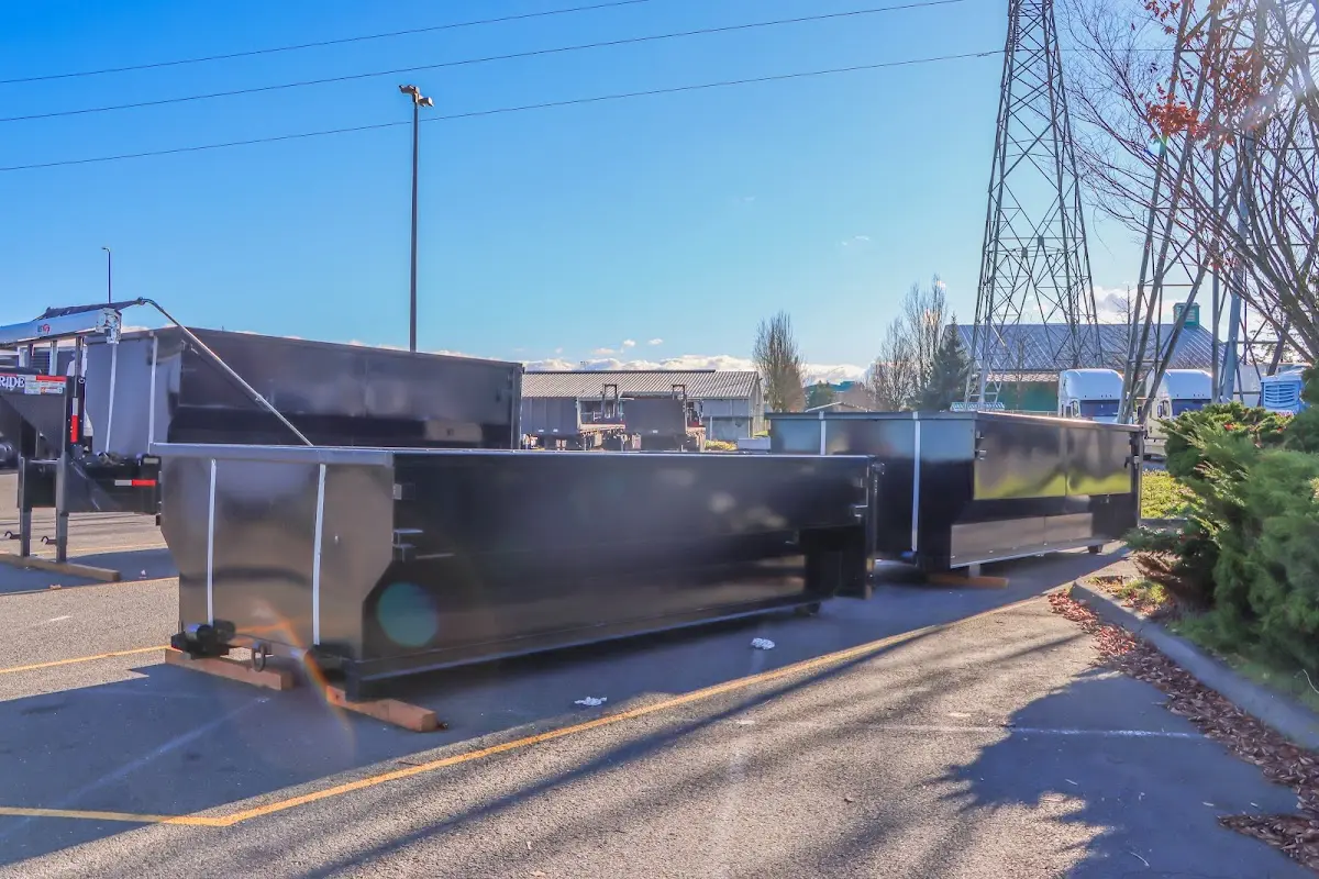 Roll-off dumpster ready for waste disposal at job site for 15 Yard Dumpster Rental in Stonecrest